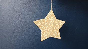 Star ornament - white design on raw clay
